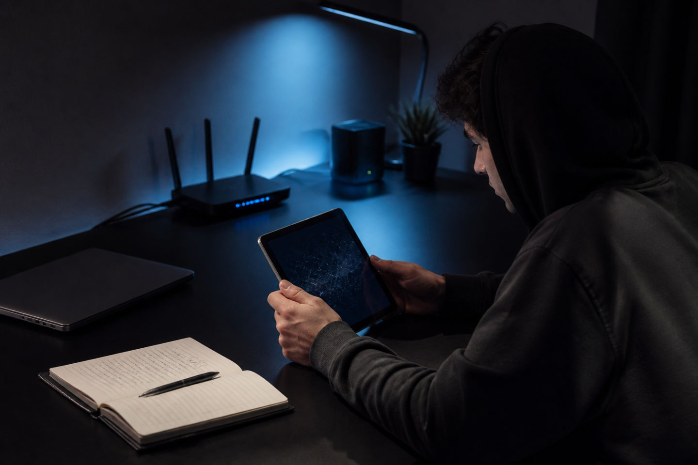 person accessing Darknet AI resources on a tablet